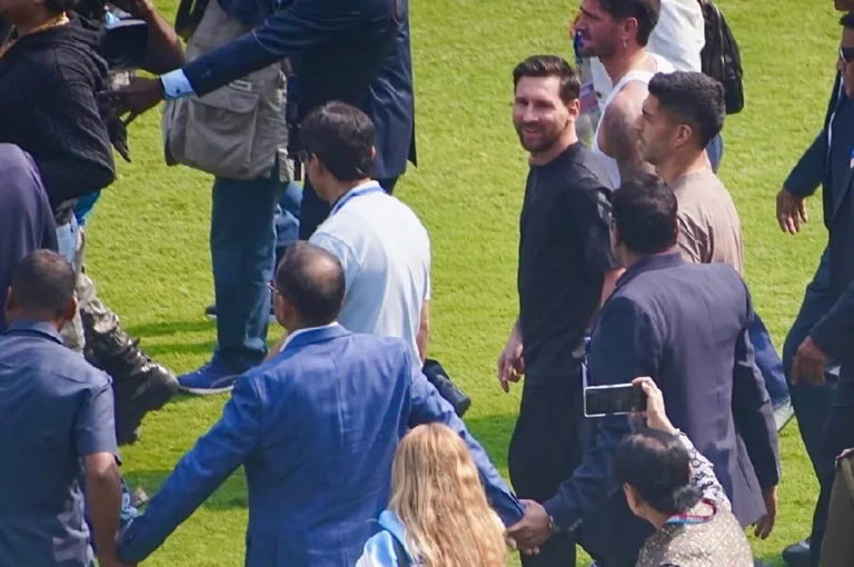 Lionel Messi in India surrounded by fans and officials showing the difference between Kolkata Chaos vs Hyderabad Harmony during his football tour 2025.