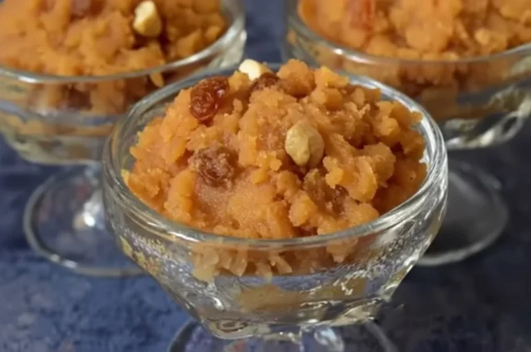 “Nolen Gur Dessert served in glass bowls, a traditional Bengali sweet made with date palm jaggery, garnished with raisins and nuts.”