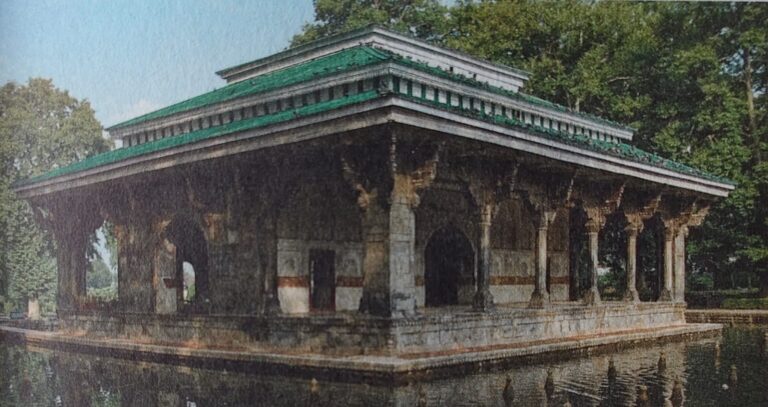 Shalimar Bagh Kashmir with Mughal-style terraces, flowing fountains, and lush gardens surrounded by scenic mountain views