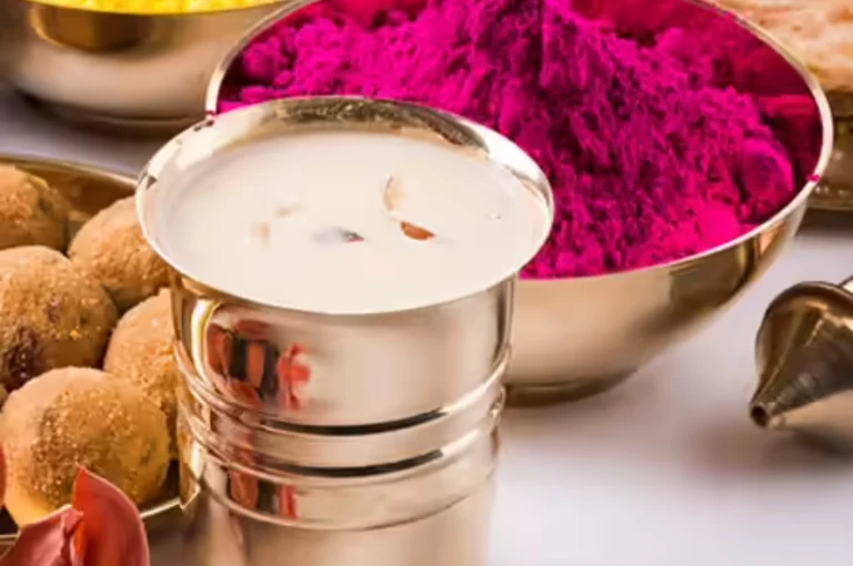 Holi special thandai recipe 2026: served in festive glasses with saffron, almonds, rose petals, and natural colors for a healthy celebration.