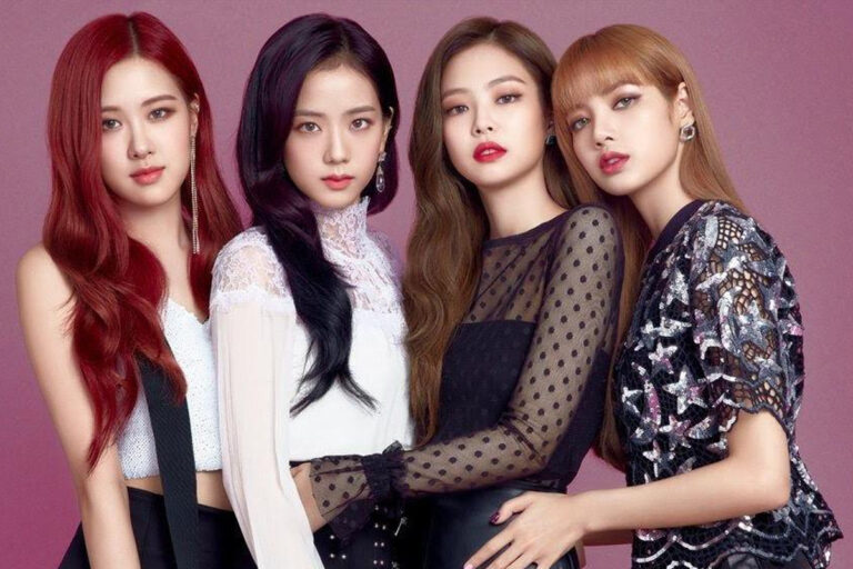 Four members of K-pop girl group BLACKPINK representing global luxury brands at a glamorous international fashion show