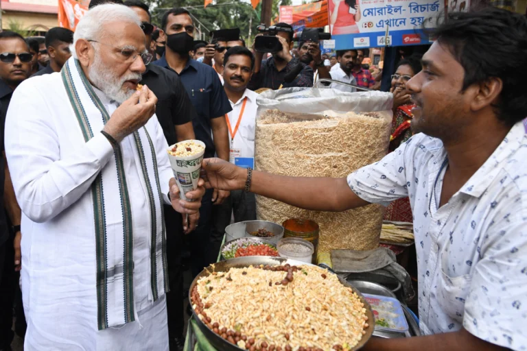 Jhalmuri Politics BengalNarendra Modi eating jhalmuri from a roadside stall in West Bengal during election campaign