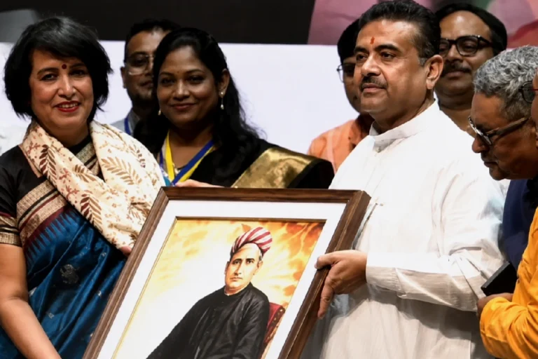 Shubhendu Adhikari welcomes Taslima Nasrin during the Taslima Nasrin Kolkata Visit at a public event in Rabindra Sadan, highlighting freedom of expression and cultural dialogue.